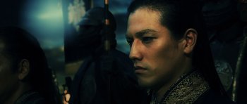 Movie still from “Goemon” (2009), directed by Kazuaki Kiriya – A person wearing a helmet; Close Up shot, Low angle