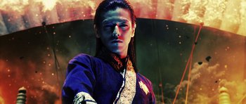 Movie still from “Goemon” (2009), directed by Kazuaki Kiriya – A man with long black hair wearing a purple shirt; Close Up shot, Low angle