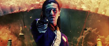 Movie still from “Goemon” (2009), directed by Kazuaki Kiriya – A man holding a gun in his right hand; Close Up shot, Low angle