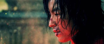 Movie still from “Goemon” (2009), directed by Kazuaki Kiriya – A person with wet hair; Extreme Close Up shot, Low angle