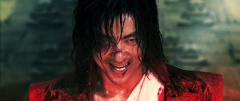 Movie still from “Goemon” (2009), directed by Kazuaki Kiriya – A person with blood all over his face; Close Up shot, Low angle