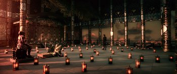 Movie still from “Goemon” (2009), directed by Kazuaki Kiriya – A man standing next to a group of lit candles; Extreme Wide shot, High angle