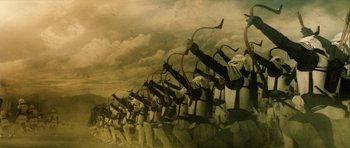 Movie still from “Goemon” (2009), directed by Kazuaki Kiriya – A painting of a bunch of people with bows; Extreme Wide shot, Low angle