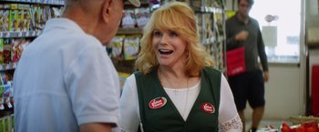 Movie still from “Going in Style” (2017), directed by Zach Braff – A woman in a store talking to a man; Close Up shot, Over the shoulder angle