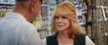 Movie still from “Going in Style” (2017), directed by Zach Braff – An older woman talking to an older man in a store; Close Up shot, Over the shoulder angle