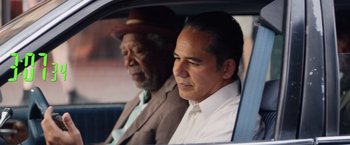 Movie still from “Going in Style” (2017), directed by Zach Braff – A man and a man sitting in the back of a car; Close Up shot, Over the shoulder angle