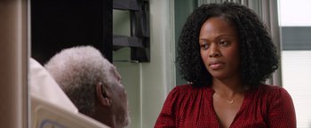 Movie still from “Going in Style” (2017), directed by Zach Braff – An older man and a young black woman in front of a mirror; Close Up shot, Over the shoulder angle