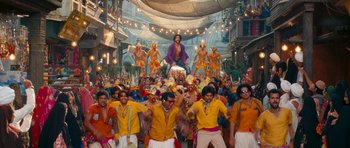 Movie still from “Goliyon Ki Raasleela Ram Leela” (2013), directed by Sanjay Leela Bhansali – A group of people dressed in yellow and orange; Wide shot, Low angle
