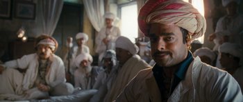 Movie still from “Goliyon Ki Raasleela Ram Leela” (2013), directed by Sanjay Leela Bhansali – A group of men sitting in front of each other; Close Up shot, Low angle