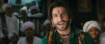 Movie still from “Goliyon Ki Raasleela Ram Leela” (2013), directed by Sanjay Leela Bhansali – A person with a beard wearing a green shirt; Close Up shot, Low angle
