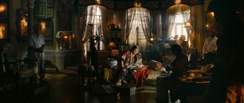 Movie still from “Goliyon Ki Raasleela Ram Leela” (2013), directed by Sanjay Leela Bhansali – Two women sitting on a couch in a living room; Wide shot, High angle
