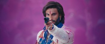 Movie still from “Goliyon Ki Raasleela Ram Leela” (2013), directed by Sanjay Leela Bhansali – A man with long brown hair holding a gun; Close Up shot, Low angle