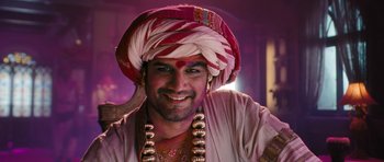 Movie still from “Goliyon Ki Raasleela Ram Leela” (2013), directed by Sanjay Leela Bhansali – A man wearing a turban and smiling for the camera; Close Up shot, Low angle