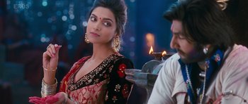 Movie still from “Goliyon Ki Raasleela Ram Leela” (2013), directed by Sanjay Leela Bhansali – Deepika padukon in a red and black outfit; Close Up shot, Over the shoulder angle