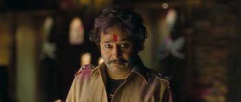 Movie still from “Goliyon Ki Raasleela Ram Leela” (2013), directed by Sanjay Leela Bhansali – A man with a face tattoo and a red forehead; Close Up shot, Low angle