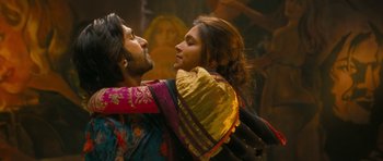Movie still from “Goliyon Ki Raasleela Ram Leela” (2013), directed by Sanjay Leela Bhansali – A man and a woman are hugging in a dark room; Medium shot, Low angle