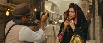 Movie still from “Goliyon Ki Raasleela Ram Leela” (2013), directed by Sanjay Leela Bhansali – A man taking a picture of a woman wearing a headscarf; Close Up shot, Over the shoulder angle