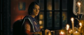 Movie still from “Goliyon Ki Raasleela Ram Leela” (2013), directed by Sanjay Leela Bhansali – A woman standing in front of a window with candles; Medium shot, High angle
