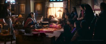 Movie still from “Goliyon Ki Raasleela Ram Leela” (2013), directed by Sanjay Leela Bhansali – A group of people sitting on a bed in front of a window; Wide shot, High angle