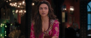 Movie still from “Goliyon Ki Raasleela Ram Leela” (2013), directed by Sanjay Leela Bhansali – Deepika padukon in a pink and red outfit; Close Up shot, Over the shoulder angle