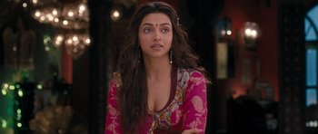 Movie still from “Goliyon Ki Raasleela Ram Leela” (2013), directed by Sanjay Leela Bhansali – Deepika padukon in a pink dress with long black hair; Close Up shot, Over the shoulder angle