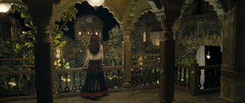 Movie still from “Goliyon Ki Raasleela Ram Leela” (2013), directed by Sanjay Leela Bhansali – A woman standing in front of a balcony at night; Wide shot, Over the shoulder angle