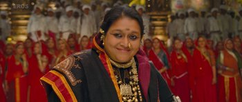 Movie still from “Goliyon Ki Raasleela Ram Leela” (2013), directed by Sanjay Leela Bhansali – A woman in a black and red outfit with gold jewelry; Close Up shot, Low angle