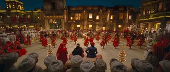 Movie still from “Goliyon Ki Raasleela Ram Leela” (2013), directed by Sanjay Leela Bhansali – A group of people are dancing in front of a building; Extreme Wide shot, High angle