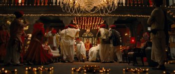 Movie still from “Goliyon Ki Raasleela Ram Leela” (2013), directed by Sanjay Leela Bhansali – A group of people gathered around a woman in a red turban; Wide shot, High angle