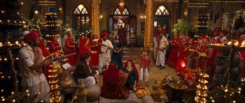 Movie still from “Goliyon Ki Raasleela Ram Leela” (2013), directed by Sanjay Leela Bhansali – A group of people gathered in a large room; Wide shot, High angle