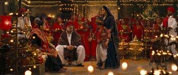 Movie still from “Goliyon Ki Raasleela Ram Leela” (2013), directed by Sanjay Leela Bhansali – A group of people standing in a room with lights; Wide shot, High angle