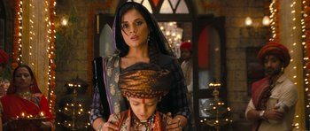 Movie still from “Goliyon Ki Raasleela Ram Leela” (2013), directed by Sanjay Leela Bhansali – A woman standing next to a young boy wearing a turban; Close Up shot, Over the shoulder angle
