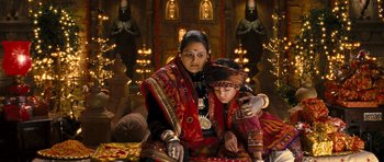Movie still from “Goliyon Ki Raasleela Ram Leela” (2013), directed by Sanjay Leela Bhansali – A woman and a child sitting in front of an altar; Medium shot, High angle