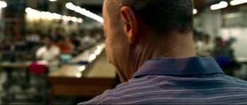 Movie still from “Gomorrah” (2008), directed by Matteo Garrone – A man's face in a room; Extreme Close Up shot, Over the shoulder angle