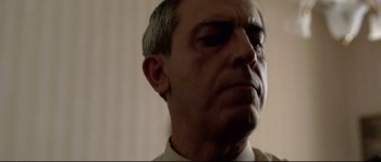 Movie still from “Gomorrah” (2008), directed by Matteo Garrone – A person wearing a shirt; Close Up shot, Low angle