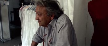 Movie still from “Gomorrah” (2008), directed by Matteo Garrone – An older man sitting in front of a window; Close Up shot, Low angle