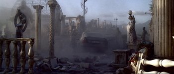 Movie still from “Gomorrah” (2008), directed by Matteo Garrone – A car is driving through a dust storm in a city; Wide shot, High angle