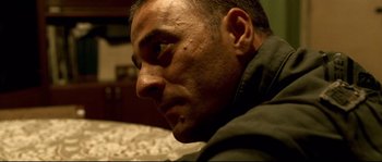 Movie still from “Gomorrah” (2008), directed by Matteo Garrone – A man's face as he stares off into the distance; Close Up shot, Low angle