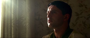 Movie still from “Gomorrah” (2008), directed by Matteo Garrone – A person looking up at the sky; Close Up shot, Low angle