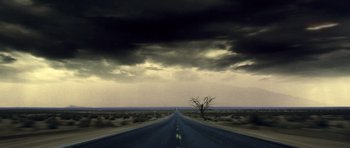 Movie still from “Gone in 60 Seconds” (2000), directed by Dominic Sena – A lone tree stands on the side of a road; Extreme Wide shot, Low angle