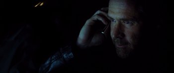 Movie still from “Gone in 60 Seconds” (2000), directed by Dominic Sena – A person talking on a cell phone; Close Up shot, Low angle