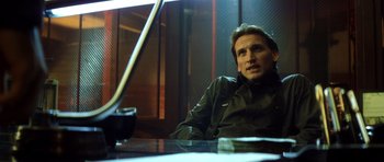 Movie still from “Gone in 60 Seconds” (2000), directed by Dominic Sena – A man sitting at a table in a dark room; Close Up shot, Over the shoulder angle