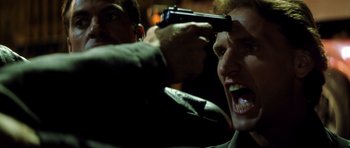 Movie still from “Gone in 60 Seconds” (2000), directed by Dominic Sena – A man holding a gun up to his head; Close Up shot, Low angle