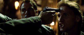 Movie still from “Gone in 60 Seconds” (2000), directed by Dominic Sena – A man holding a gun pointed at another man's face; Close Up shot, Over the shoulder angle