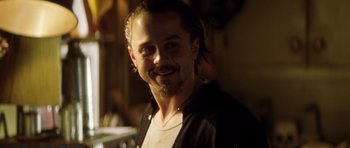 Movie still from “Gone in 60 Seconds” (2000), directed by Dominic Sena – A person smiling for the camera; Close Up shot, Over the shoulder angle