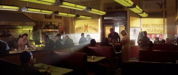 Movie still from “Gone in 60 Seconds” (2000), directed by Dominic Sena – A group of people sitting in a restaurant; Wide shot, Low angle
