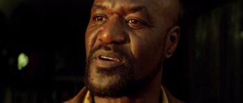 Movie still from “Gone in 60 Seconds” (2000), directed by Dominic Sena – A man's face with a beard; Close Up shot, Low angle