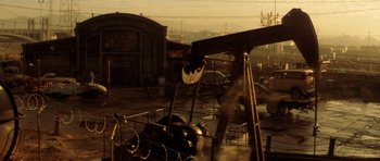 Movie still from “Gone in 60 Seconds” (2000), directed by Dominic Sena – An industrial area with a lot of machinery and buildings in the background; Extreme Wide shot, High angle
