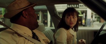 Movie still from “Gone in 60 Seconds” (2000), directed by Dominic Sena – A man and a woman sitting in the back of a car; Close Up shot, Over the shoulder angle