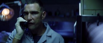 Movie still from “Gone in 60 Seconds” (2000), directed by Dominic Sena – A person wearing a lab coat; Close Up shot, Low angle